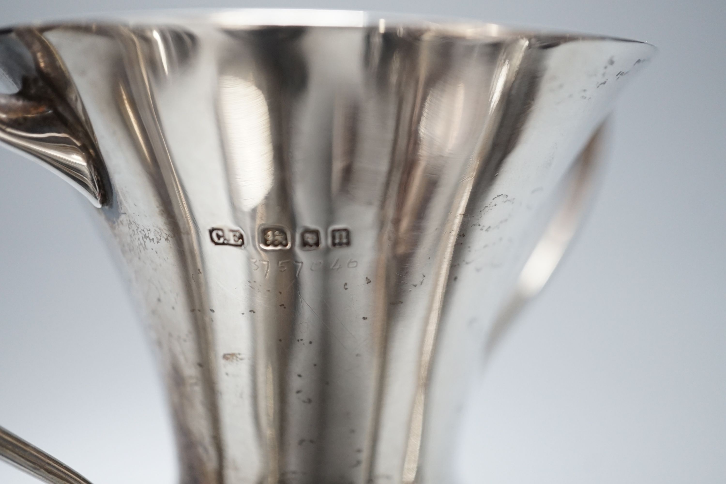 Five assorted 1920's/1930's silver two handled presentation trophy cups, all with engraved inscriptions and all with stands, largest 11.8cm.